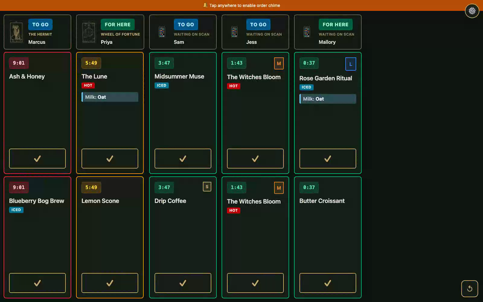 The KDS order board: five orders with color-coded wait timers